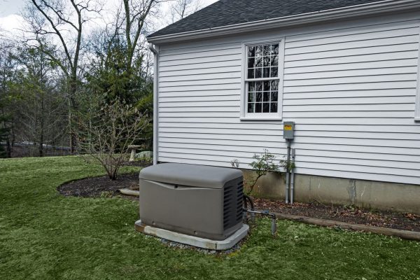 Residential standby generator on a concrete pad